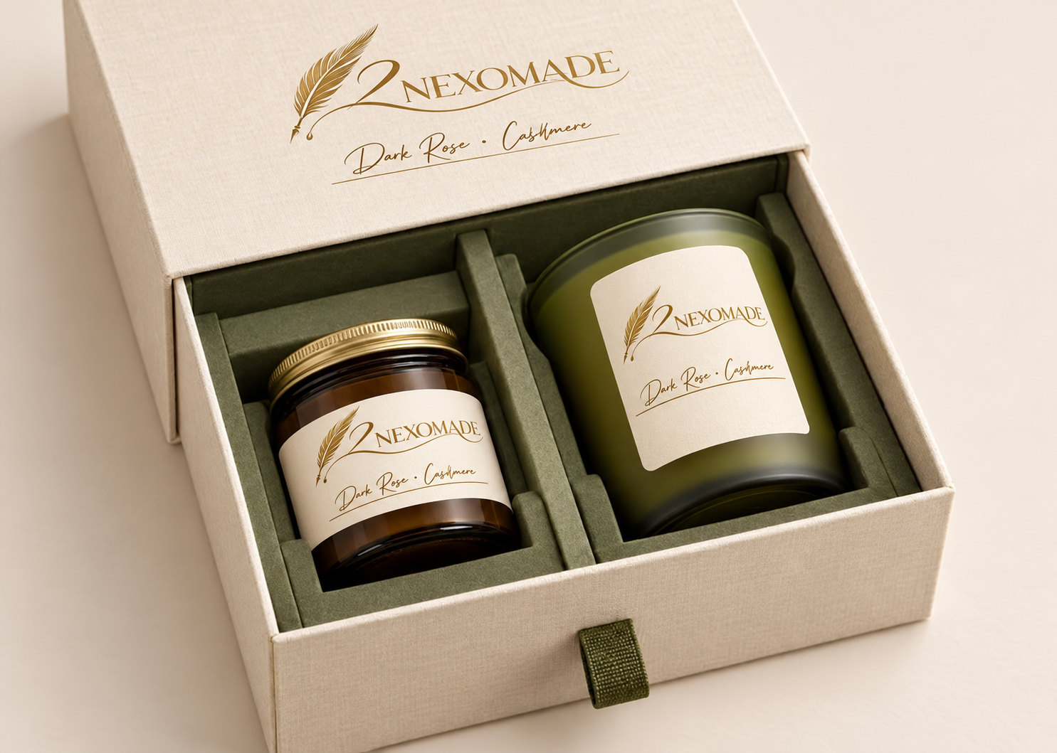 Ivory two-compartment candle gift box with olive inserts, two candle jars and gold 2NEXOMADE feather branding.
